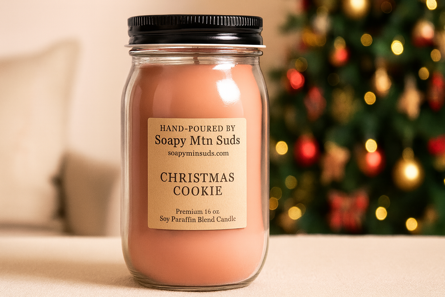 16oz Christmas Cookie Candle by Soapy Mtn Suds with Christmas tree lights in background, large hand-poured soy paraffin blend candle featuring warm sweet fresh-baked cookie aroma