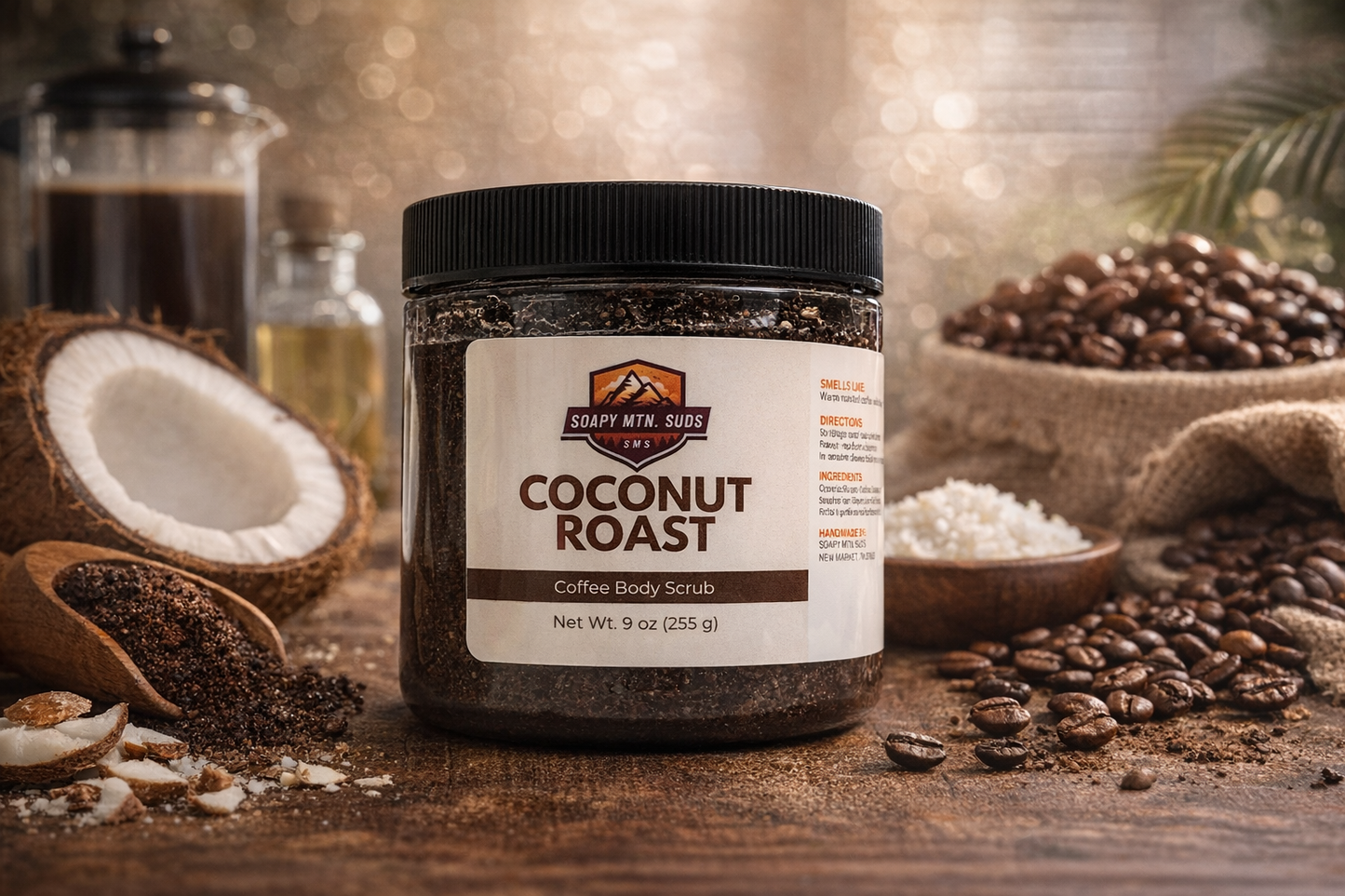 Coconut Roast coffee body scrub by Soapy Mtn Suds, exfoliating sugar scrub with roasted coffee grounds and coconut oil in 9 oz jar surrounded by coffee beans and fresh coconut