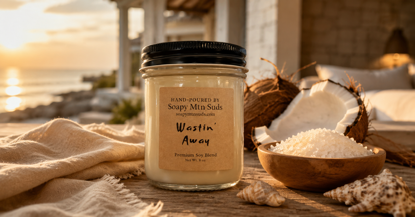 Wastin’ Away luxury coastal candle by Soapy Mtn Suds with coconut, sea salt, warm amber, and premium soy blend wax in a beach resort setting
