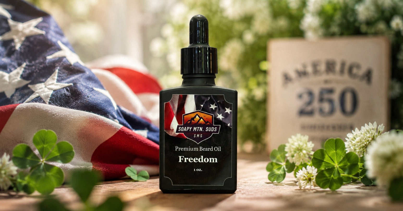 Freedom Beard Oil by Soapy Mtn Suds featuring a sweet, fresh green clover scent displayed in a patriotic America 250 and Fourth of July lifestyle setting.