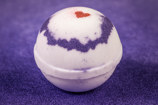 Black Razz Vanilla Shea Butter Bath Bomb by Soapy Mtn Suds with purple and white design and red heart accent, rich moisturizing bath bomb with fruity vanilla aroma