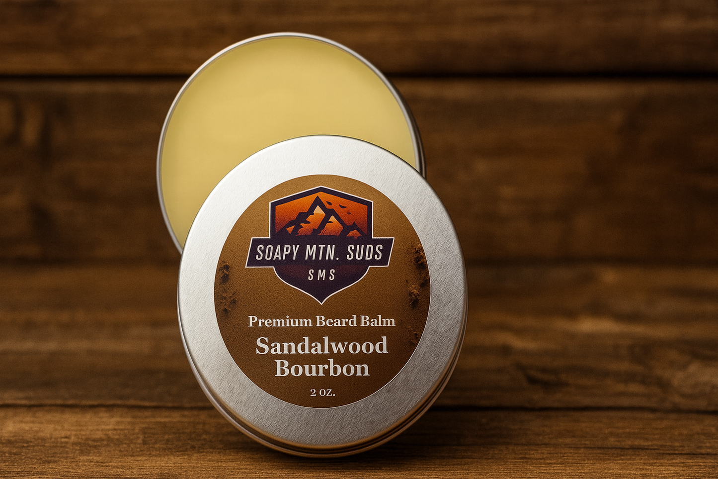 Sandalwood Bourbon Premium Beard Balm by Soapy Mtn Suds in silver tin on wood background, handcrafted beard balm with rich sandalwood and smooth bourbon scent for conditioning hold