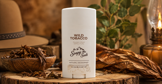 Soapy Mtn Suds Wild Tobacco Natural Deodorant with warm earthy tobacco leaves in a rustic setting